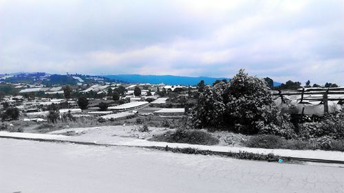 Scenic view of snow covered landscape against sky