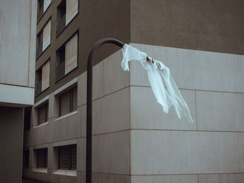 Low angle view of clothes drying against building