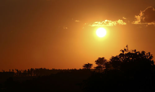 Scenic view of silhouette landscape against romantic sky at sunset