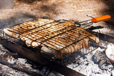 Close-up of meat on barbecue grill