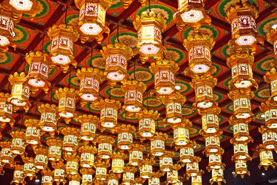 Low angle view of illuminated chandelier