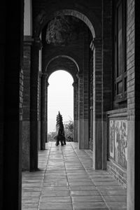 Full length of woman walking in tunnel