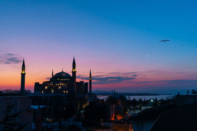 View of buildings against sky during sunset