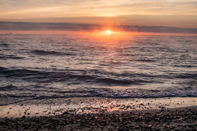 Scenic view of sea against sky during sunset