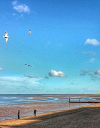 Scenic view of sea against cloudy sky