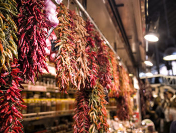 Close-up of dry peppers for sale at market stall