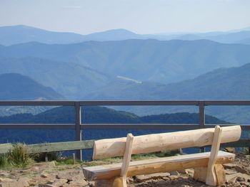 Scenic view of sea and mountains against sky