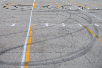 Looping car tracks in the middle of a parking lot