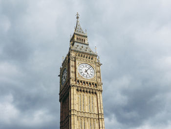 Low angle view of clock tower against sky