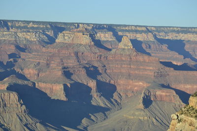 Aerial view of dramatic landscape against clear sky
