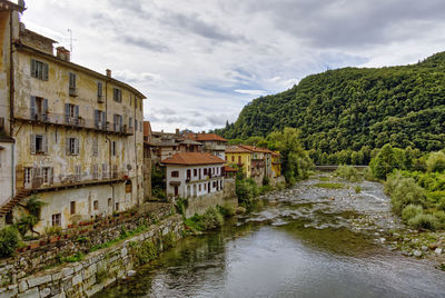 The sesia river flows through the old town of the alpine village of varallo