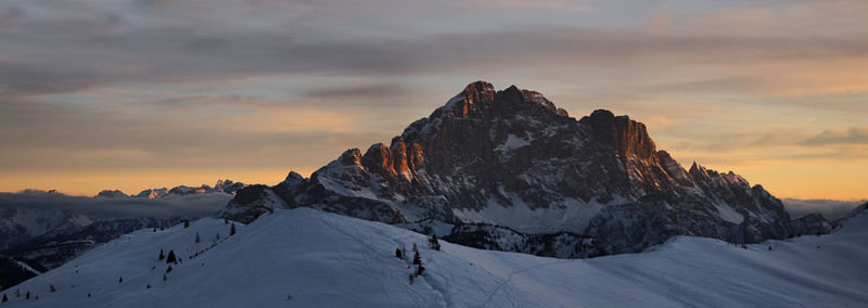 Scenic view of snowcapped mountains against sky during sunset. cortina dolomites in cadore, italy. 