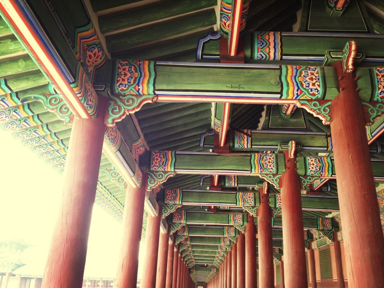 built structure, architecture, indoors, railing, in a row, hanging, architectural column, low angle view, no people, day, wood - material, text, empty, ceiling, arrangement, absence, order, steps, multi colored, non-western script