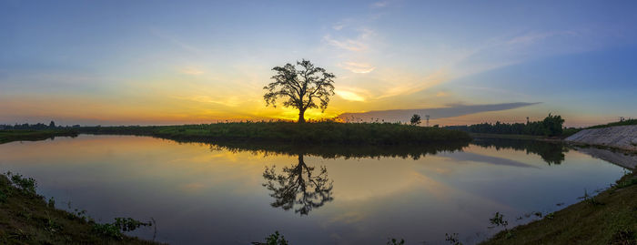 Scenic view of lake against sky during sunset