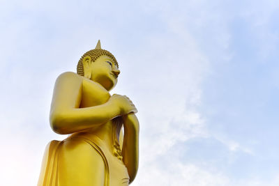 Low angle view of statue against sky