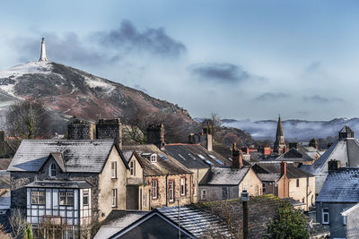 Buildings in city against sky