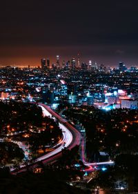 High angle view of illuminated cityscape at night