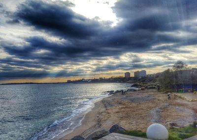 Scenic view of beach against sky during sunset