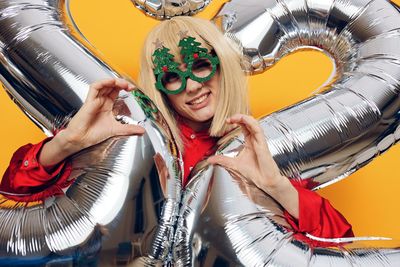 Low angle view of young woman wearing mask