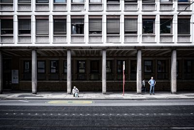 People standing on street in city