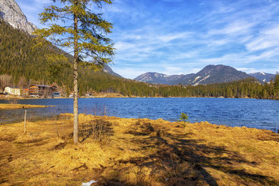 Scenic view of lake and mountains against sky