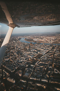 Aerial view of city and buildings against sky