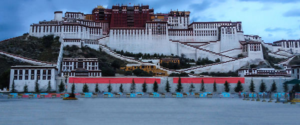 View of buildings against cloudy sky