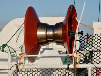 Close-up of marine equipment against sky