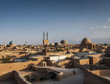 View of buildings in city against sky