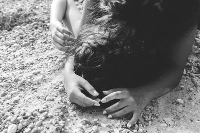 Girl playing with arms raised