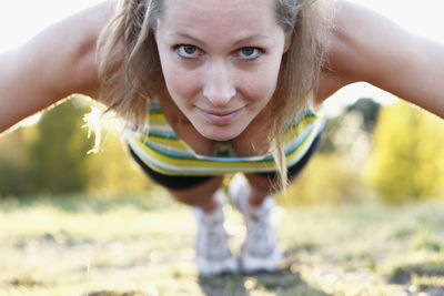 Young woman doing push ups