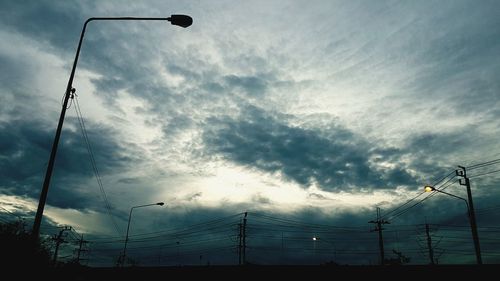 Low angle view of electricity pylon against sky