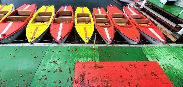 Close-up of multi colored boats moored in water