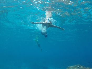 Man swimming in sea