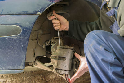 Man working in car