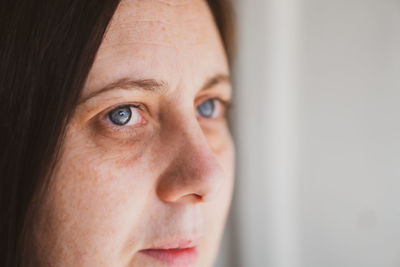 Close-up portrait of woman looking away