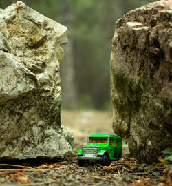 Close-up of toy car on rock