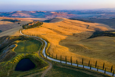 High angle view of road amidst land against sky