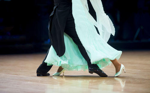 Low section of women dancing on floor