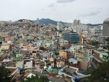 High angle view of buildings in city against sky