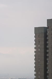 Modern buildings in city against sky