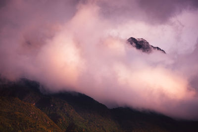 Scenic view of mountain amidst fog