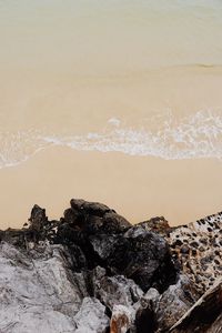 Rocks on beach against sea