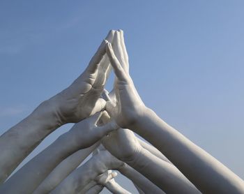 Low angle view of statue against clear blue sky