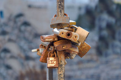 Close-up of padlocks on rusty metal