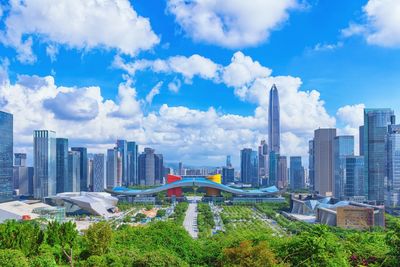 Modern buildings in city against sky