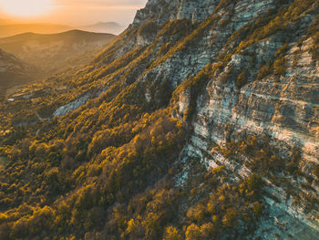 Autumn landscape in les trois becs in drôme provençale. the top rocks is covered with autumn colors