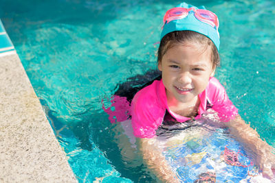 Portrait of girl in swimming pool