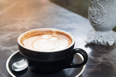 Close-up of cappuccino on table