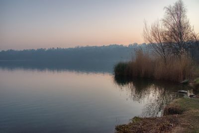 Scenic view of lake against sky during sunset